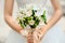Bouquet in the bride\'s hands from bush roses