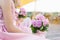 Bouquet of bridesmaids of pink hydrangea in the hands of a girl