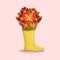 Bouquet of bright colorful flowers in yellow rain boots. Spring composition for Women's Day, Mother's Day