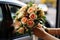 Bouquet brilliance The brides hand with a vibrant wedding bouquet