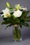 Bouquet bunch of beautiful white flowers with white roses, lily and daisy