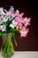 Bouquet of colorful alstroemerias flowers in glass vase