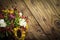 Bouquet of colorful flowers on an old wooden  background. Copy space for text or description