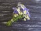 Bouquet of cornflowers, chamomile on a black wooden background