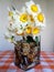 A bouquet of daffodils in a glass vase