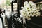 Bouquet of daisies decorating an antique wedding car