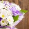 Bouquet of daisy and purple orchid