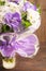 Bouquet of daisy and purple orchid on wooden background