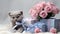 bouquet of delicate pink roses with cute kitten holding a gift, silk blue ribbons,