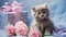 bouquet of delicate pink roses with cute kitten holding a gift, silk blue ribbons,