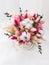 Bouquet of dried flowers in pink, beige, green, white colors in a white cardboard box. Top view