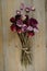 Bouquet of dried roses on a wooden