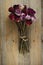 Bouquet of dried roses on a wooden background