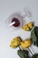 A bouquet of dried yellow roses. An overturned glass of sour wine