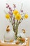 Bouquet with Easter decoration consisting of chicken figurine and wooden eggs