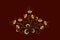 Bouquet for embroidery of orange stylized flowers with curled leaves on a burgundy background