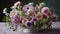 bouquet features a variety of colorful wildflowers including soft pink and purple flowers like asters, cosmos, and sweet peas