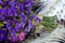 Bouquet of field and arid flowers on cloth with leopard and zebra print.