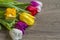 Bouquet of five delicate colored tulips with box gift