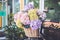 Bouquet of flower in bucket on front of vintage bicycle. Garden