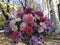 Bouquet of flowers against the backdrop of the cityscape. Wildflowers. Autumn bouquet. The beauty of flowers among the autumn city