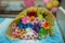 A bouquet of flowers on the table.Rainbow Daisies. Chrysanthemum Rainbow Flower. Bouquets of blossom rainbow Chrysanthemum . multi