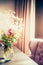 Bouquet of Flowers in Vase on a table by the window, cozy home