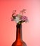 bouquet of flowers white pink yellow from the neck of the bottle. womens day, floral wine aromas. red background