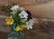 bouquet flowers wood wall glass vase