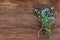 Bouquet of forget-me-nots on old wooden background