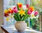 Bouquet of fresh colorful garden flowers like tulips and narcissus located in ceramic vase