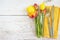 Bouquet of fresh tulips and vintage cutlery