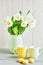 Bouquet of fresh white tulips in vase. Greeting card for mother`s day or happy birthday. Space for text. Easter, Spring or summer