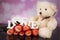 A bouquet of haber roses and a teddy bear mascot. Valentine`s Day