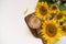 A bouquet of large sunflowers and hot coffee. Sunflower arrangement flat lay style on background white