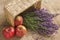 Bouquet of lavagna in a basket with an apple