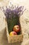 Bouquet of lavagna in a basket with an apple