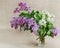 Bouquet of lilac in glass vase. Fresh flowers lilac