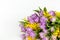 Bouquet of lilac tulips and yellow mimosas on white background, copy space, side view, closeup. March 8, February 14, birthday,