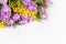 Bouquet of lilac tulips and yellow mimosas on white background, copy space, side view, closeup. March 8, February 14, birthday,