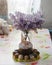 Bouquet of lilacs near Easter cakes and colored eggs.