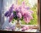 bouquet of lilacs in a vase on the window.