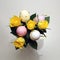 A bouquet made of Easter eggs and yellow roses