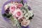 Bouquet of miniature roses on striped background