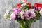 Bouquet of mixed anemones flowers in vase . the work of the florist at a flower shop.