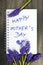 Bouquet and notepad with words `happy mother`s day`