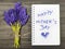 Bouquet and notepad with words `happy mother`s day`