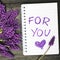 Bouquet and notepad with words `for you`