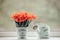 Bouquet of orange peony tulips in a bucket on a windowsill