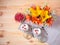 Bouquet of orange and yellow lilies and white hydrangea flowers, italian dessert panna cotta in glass jars and fresh raspberry.